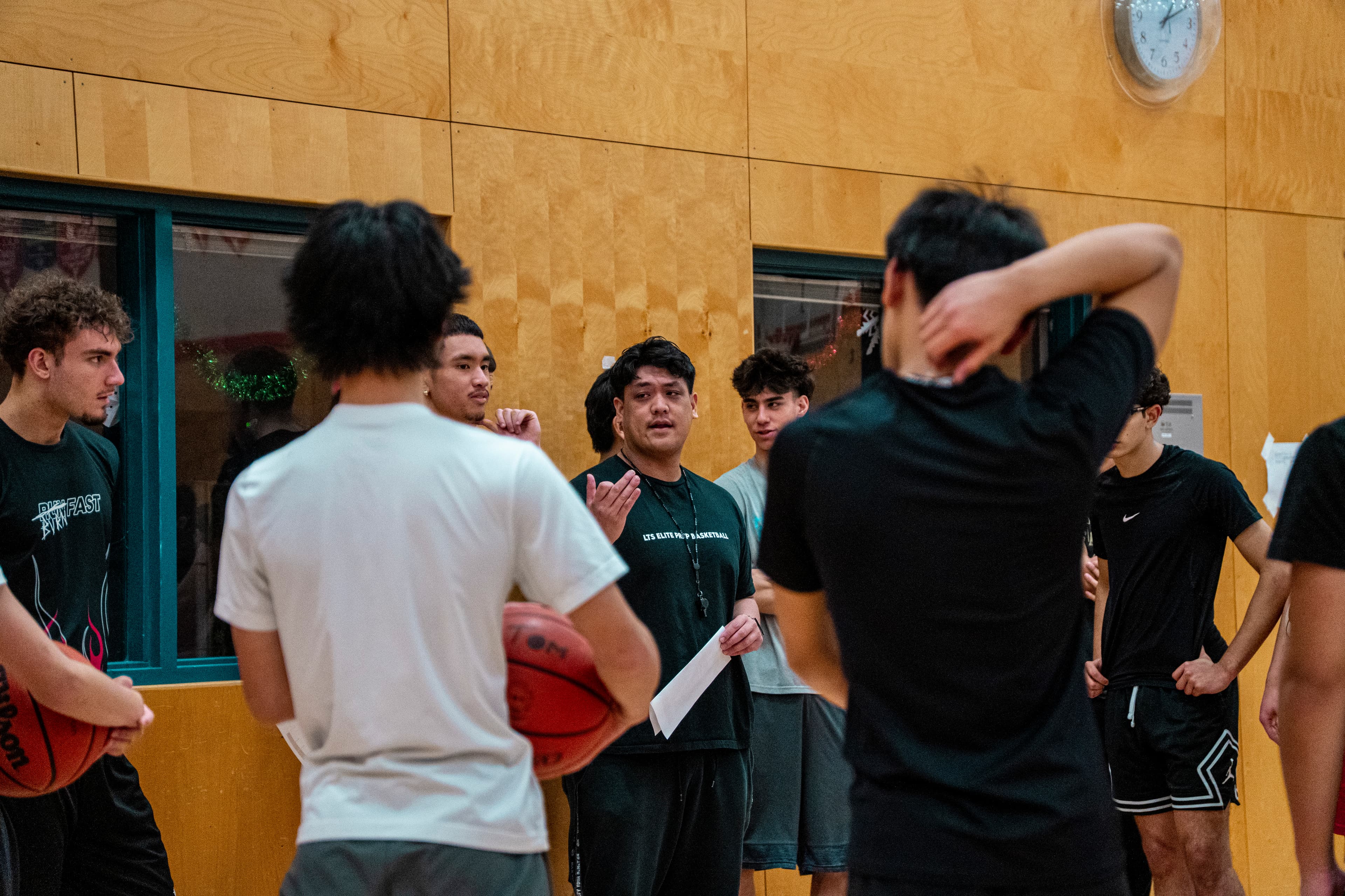 Coach speaking to team